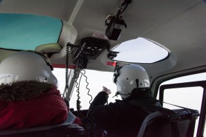 Helmets are equipped with microphones so passengers can communicate with the pilots during the trip. McMurdo pilots like pointing out the sights. On this trip, returning from New Harbor, I was sitting in the back seat of a four-seat helicopter.